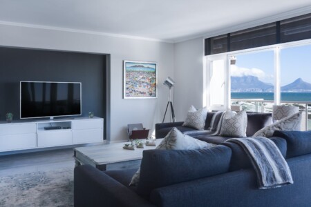 Stylish living room with a view of Table Mountain, blending modern design with natural beauty.