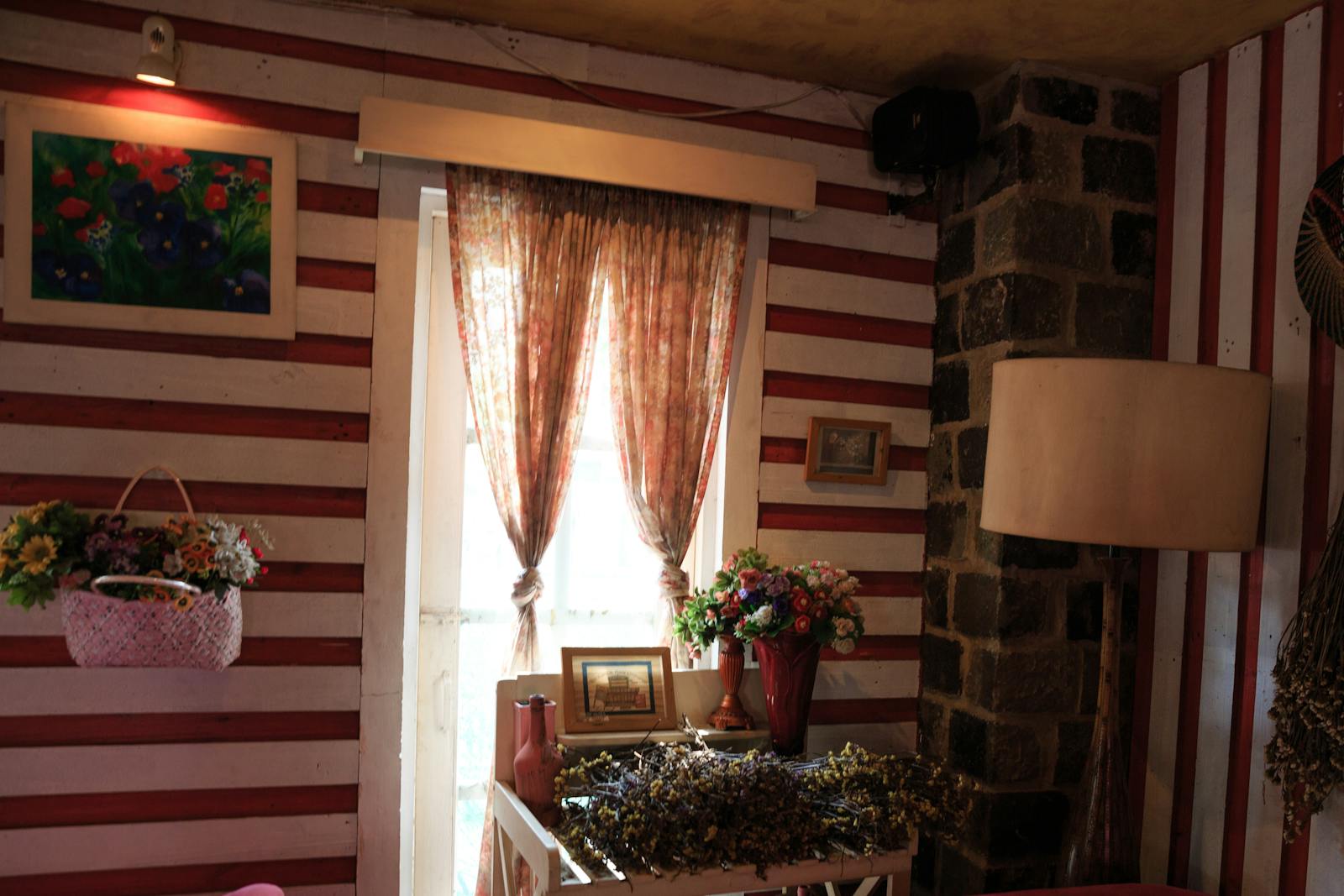 Warm and inviting home interior featuring floral decorations and a striped wall design.